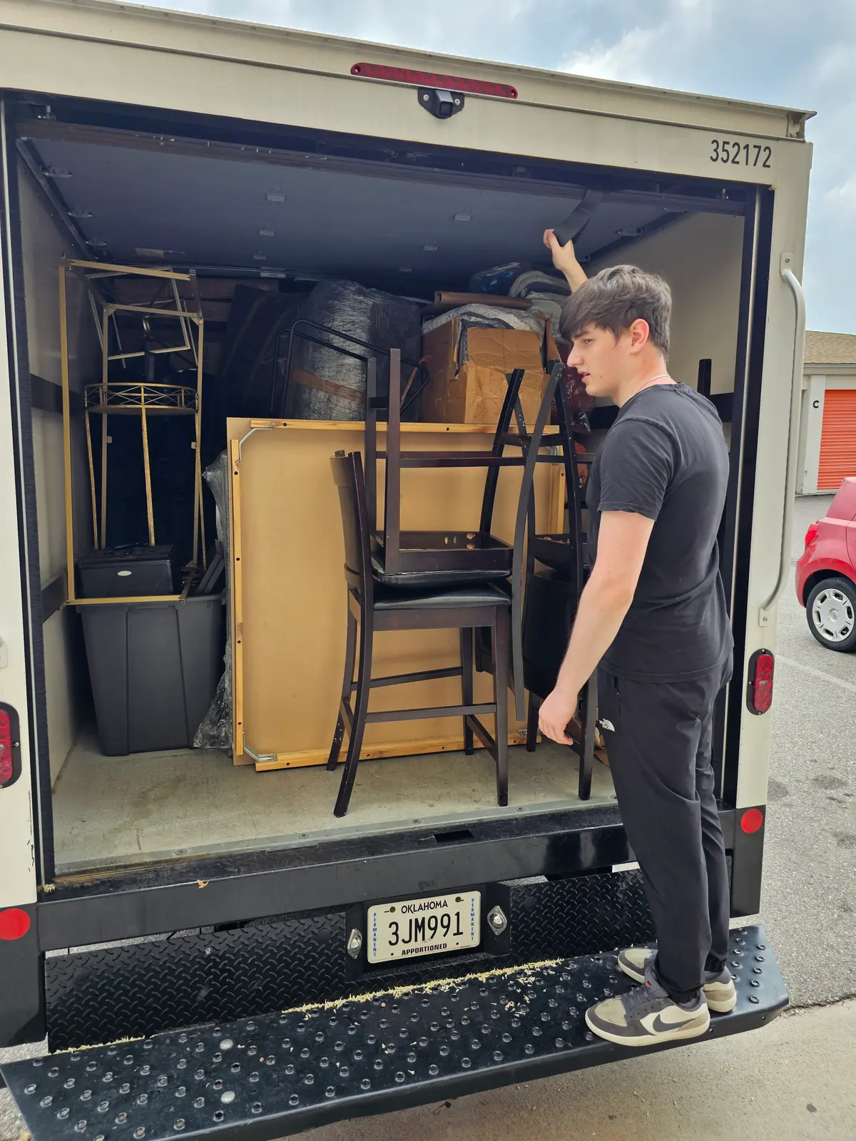 Mover arranging furniture inside the truck