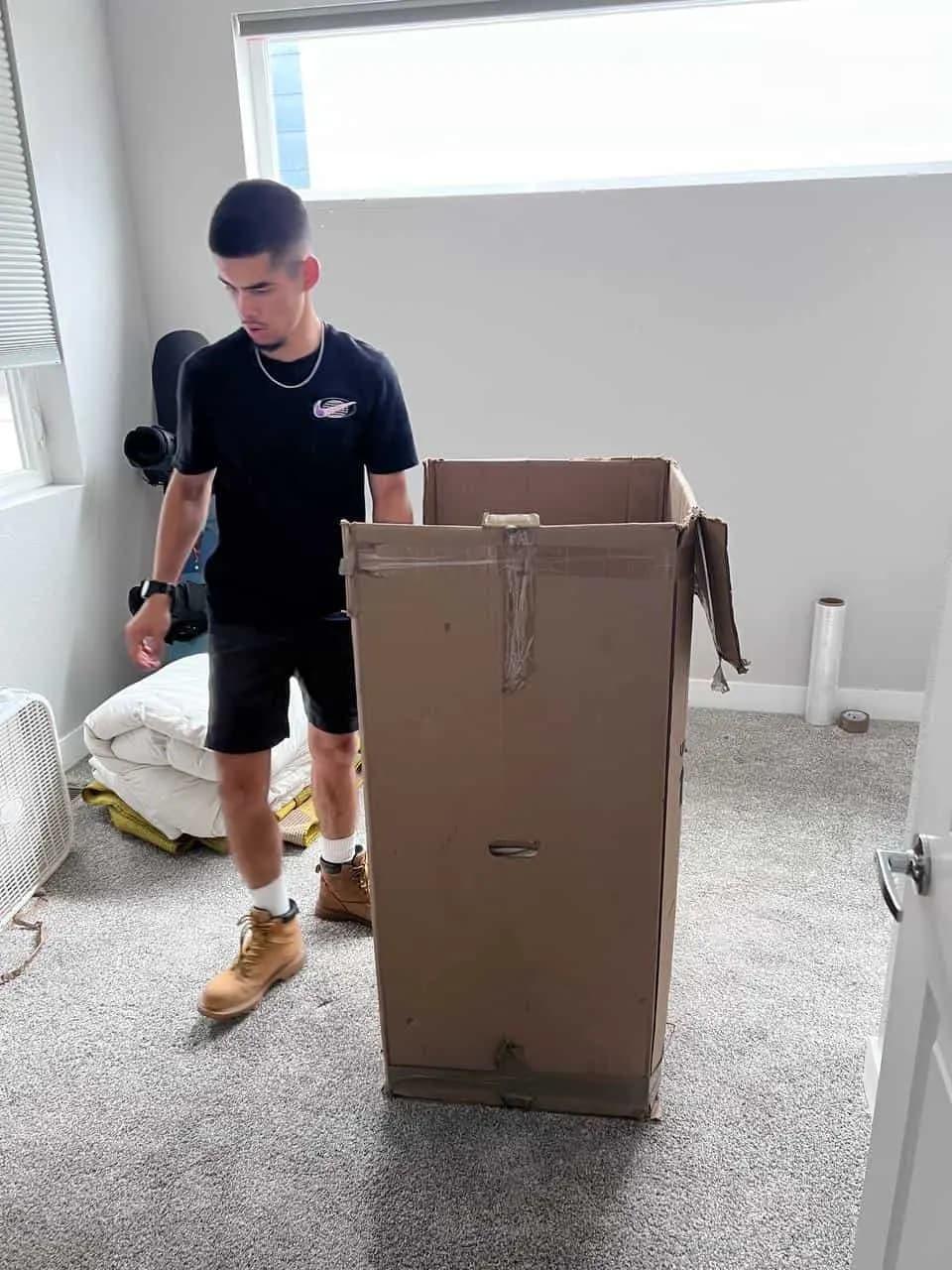 Mover assembling a wardrobe box